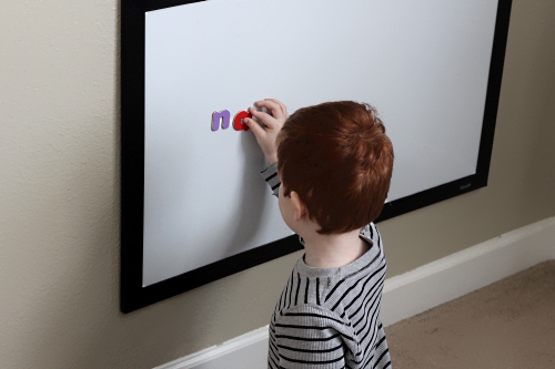Placing magnet letters on the magnet board