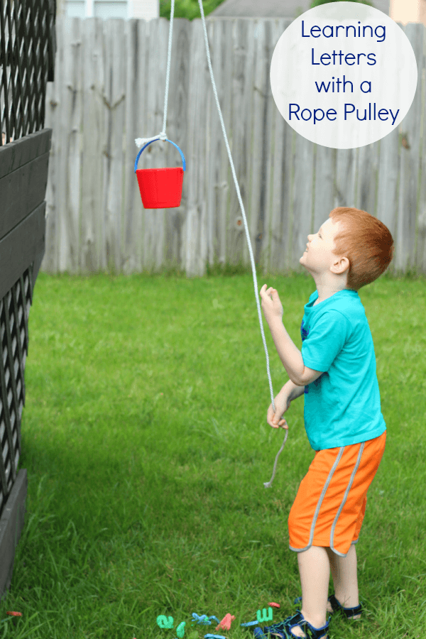 Preschool alphabet activity with a rope pulley. A STEM activity and introduction to simple machines.