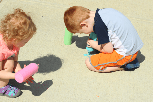 Painting on the sidewalk with puffy paint!