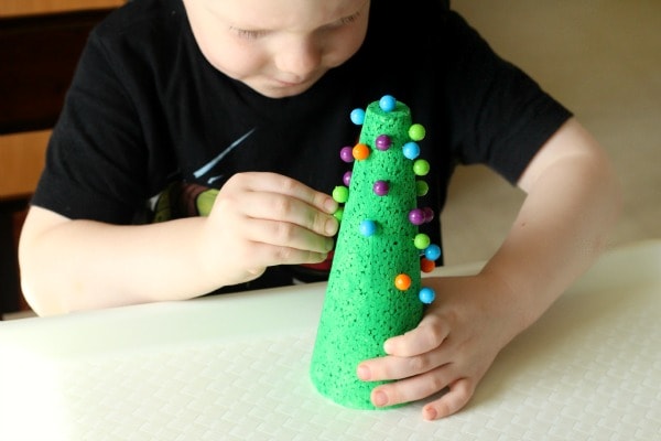 Christmas fine motor activity for preschoolers. Using push pins to develop pincer grasp.