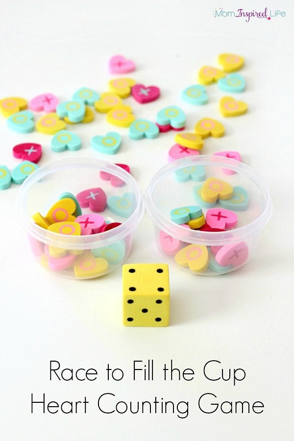 Race to fill the cup counting game with mini erasers. Valentine's Day game for preschoolers.