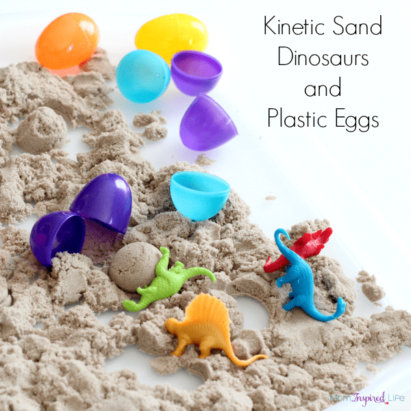 Playing with kinetic sand, dinosaurs and plastic eggs. A fun sensory activity that is great for developing fine motor skills!
