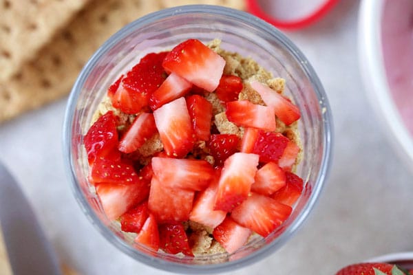 Strawberries and graham cracker yogurt parfait.