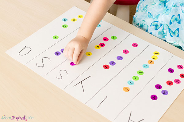 Teaching names to preschoolers can be fun with this dot sticker name activity that also helps develop fine motor skills!