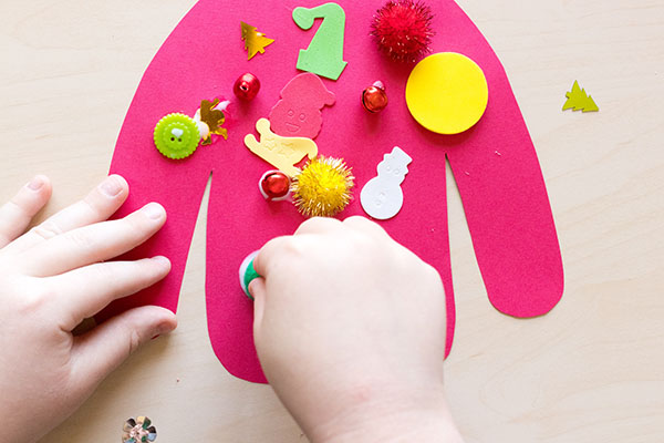 Decorate an ugly Christmas sweater collage craft for preschool and elementary.