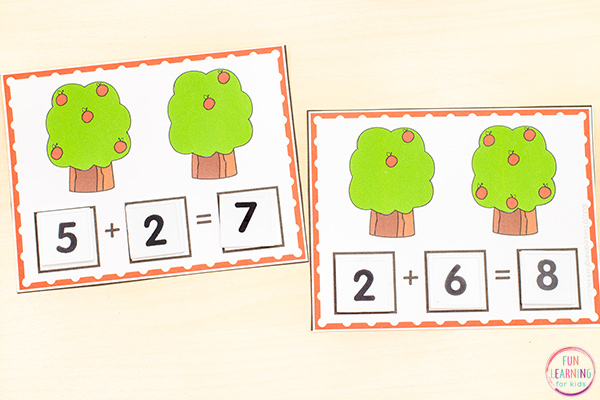 Addition cards with two apple trees on each card. Count the apples on each tree and add them together. Then create a number sentence to match. 