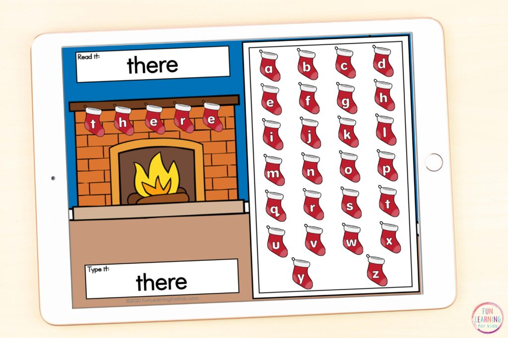 Free Google Slides and Seesaw word building activity for Christmas. Students read the word, build it on the mantle with letter tile stockings and then type it in the box at the bottom.