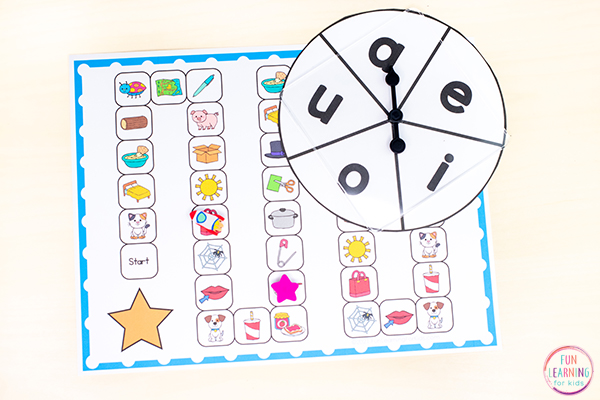 Free printable CVC middle vowel sounds board game to practice identifying vowel sounds in words.