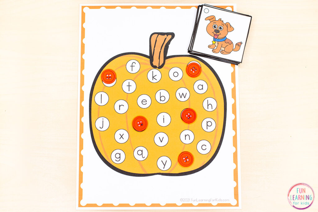 Printable fall pumpkin theme find and cover the letters literacy activity for learning to identify letters and letter sounds. 