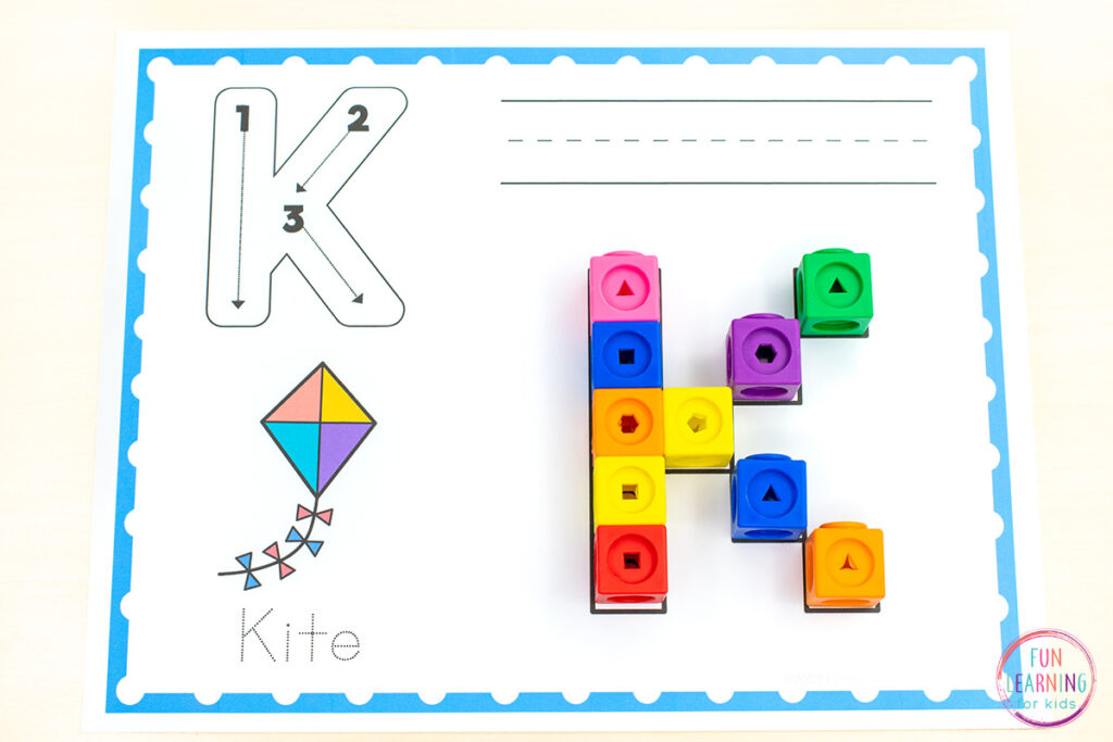 Free printable uppercase snap cube alphabet mats for kids.