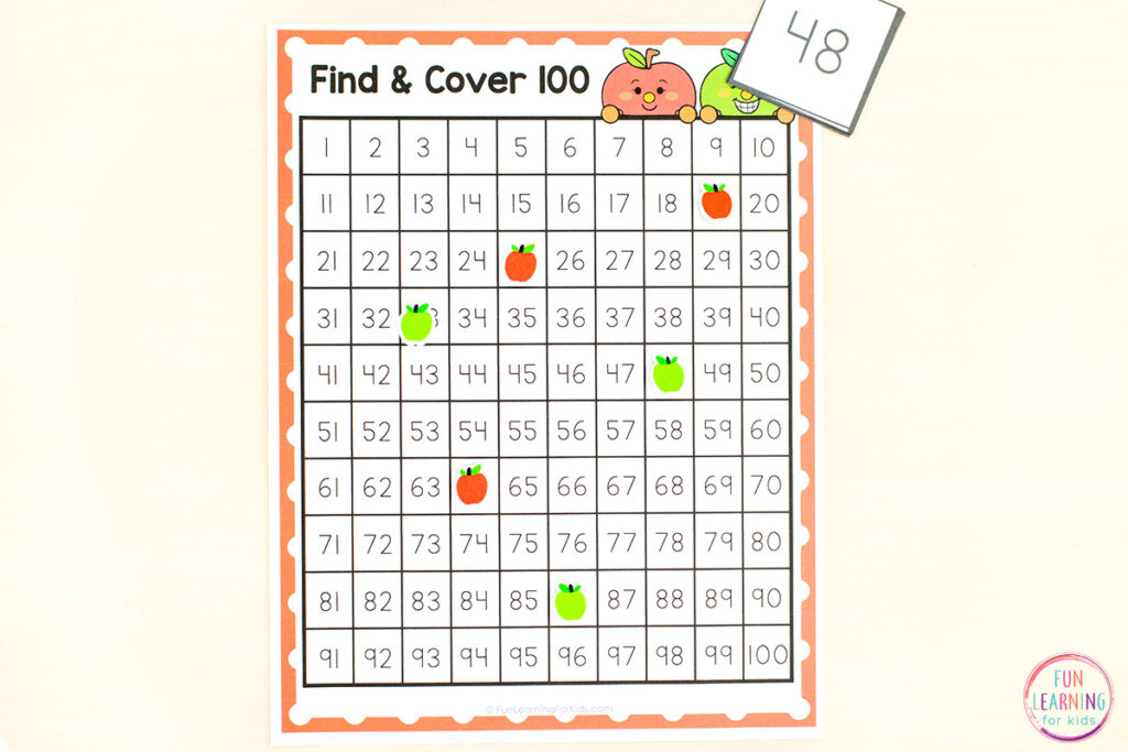 A free printable apple theme 100 chart and 120 chart game for learning numbers.