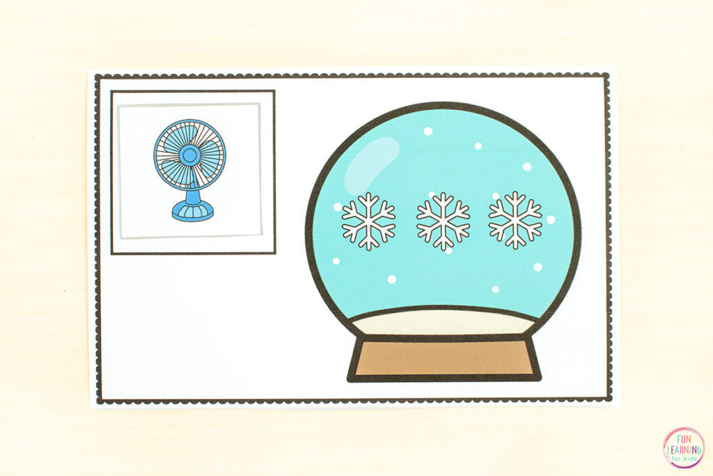 Snow globe phonemic awareness mats. Students place one finger on each dot or snowflake inside the snow globe as they segment sounds for each word card they place on the mat.