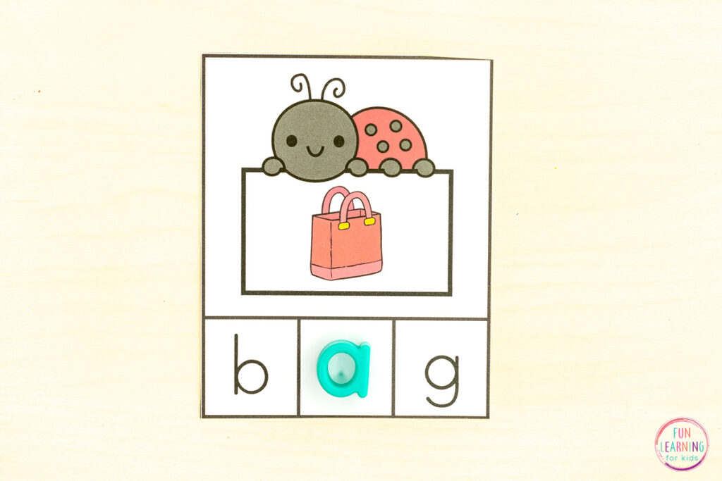 Ladybug CVC missing letter task cards phonics activity for kindergarten.